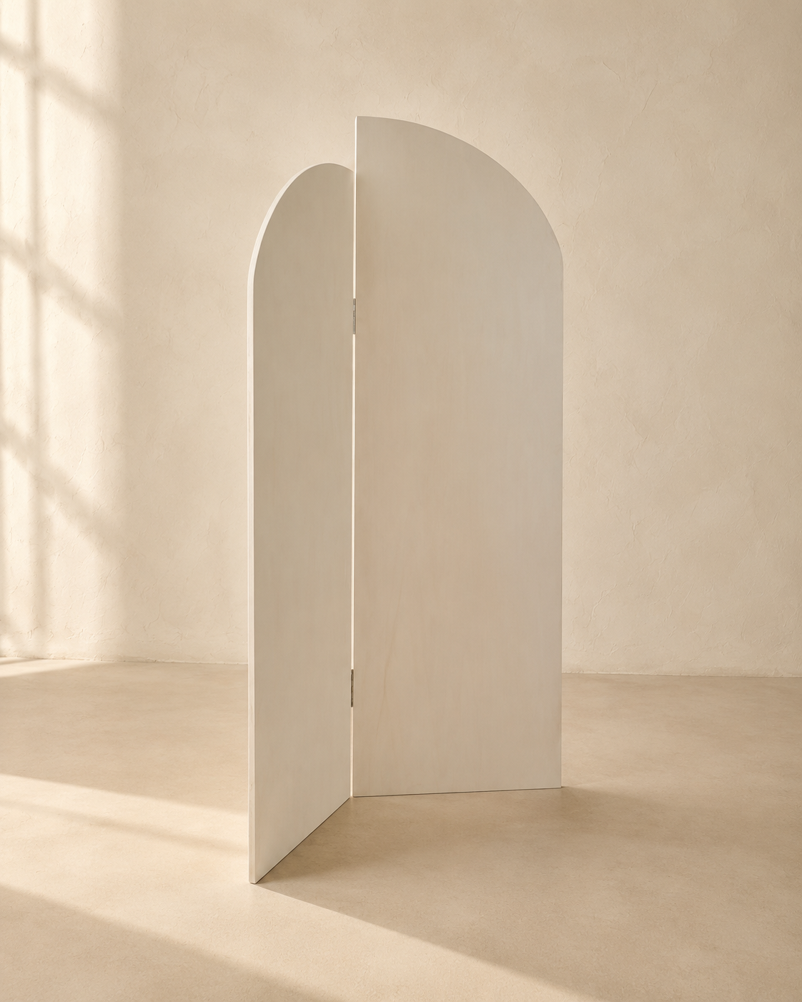 Natural unfinished wood folding arch panel against a warm neutral wall